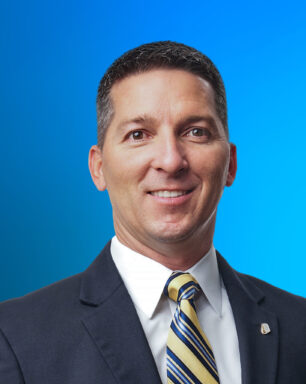 A professional portrait of Senior Vice President and Business Banking Manager Eric Mire
