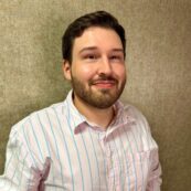 A professional headshot of Kory Fruge
