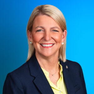 A professional headshot of Julie Miller