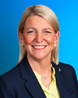 A professional headshot of Julie Miller
