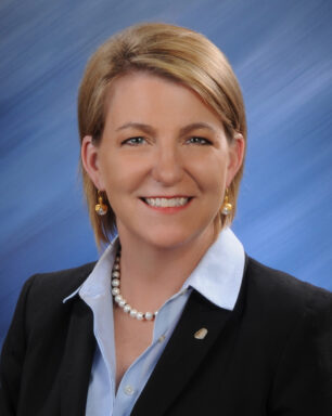 A professional headshot of Julie Miller