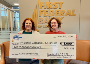 First Federal Bank of LA Marketing & Community Impact Manager Erica McCreedy (left) with Imperial Calcasieu Museum Creative Director Ashley Royer.
