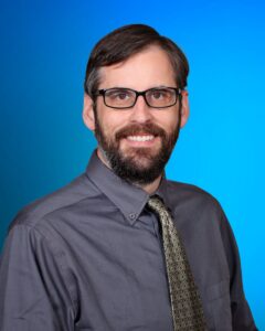 A professional portrait of John Fazende