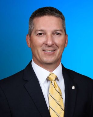 A professional portrait of business banking manager Eric Mire