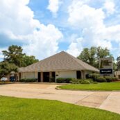 A ground level photo of the First Federal Bank of Louisiana Jackson Street Branch located at 5615-A Jackson St. in Alexandria, Louisiana.