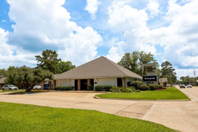 A ground level photo of the First Federal Bank of Louisiana Jackson Street Branch located at 5615-A Jackson St. in Alexandria, Louisiana.