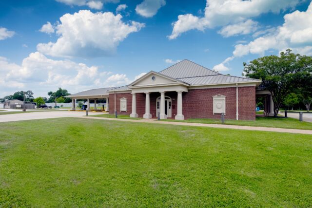 A ground level photo of the First Federal Bank of Louisiana Moss Bluff Branch located at 640 Sam Houston Jones Pkwy. in Moss Bluff, Louisiana.